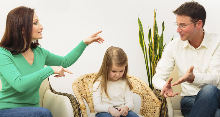 The child caught between two adults